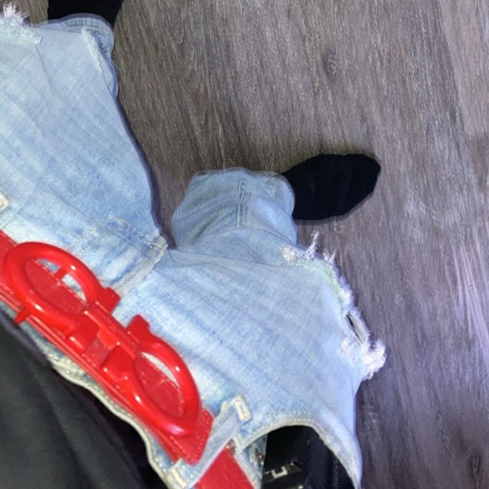 Red Ferragamo belt with logo imprinted into leather belt all around